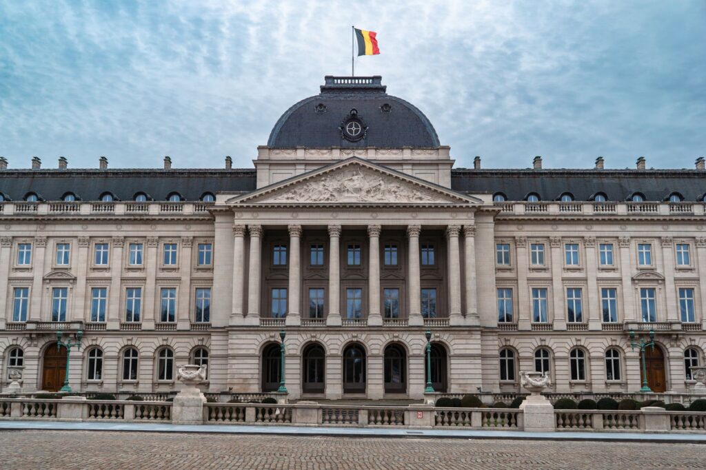 Front view of the Royal Palace of Brussels with the Belgian flag
