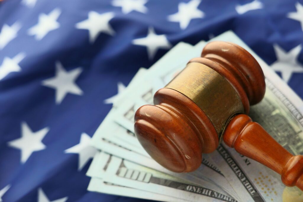 Gavel and money representing legal fines and financial penalties