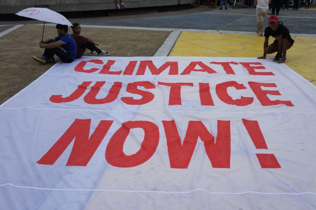 Climate Justice Now protest banner