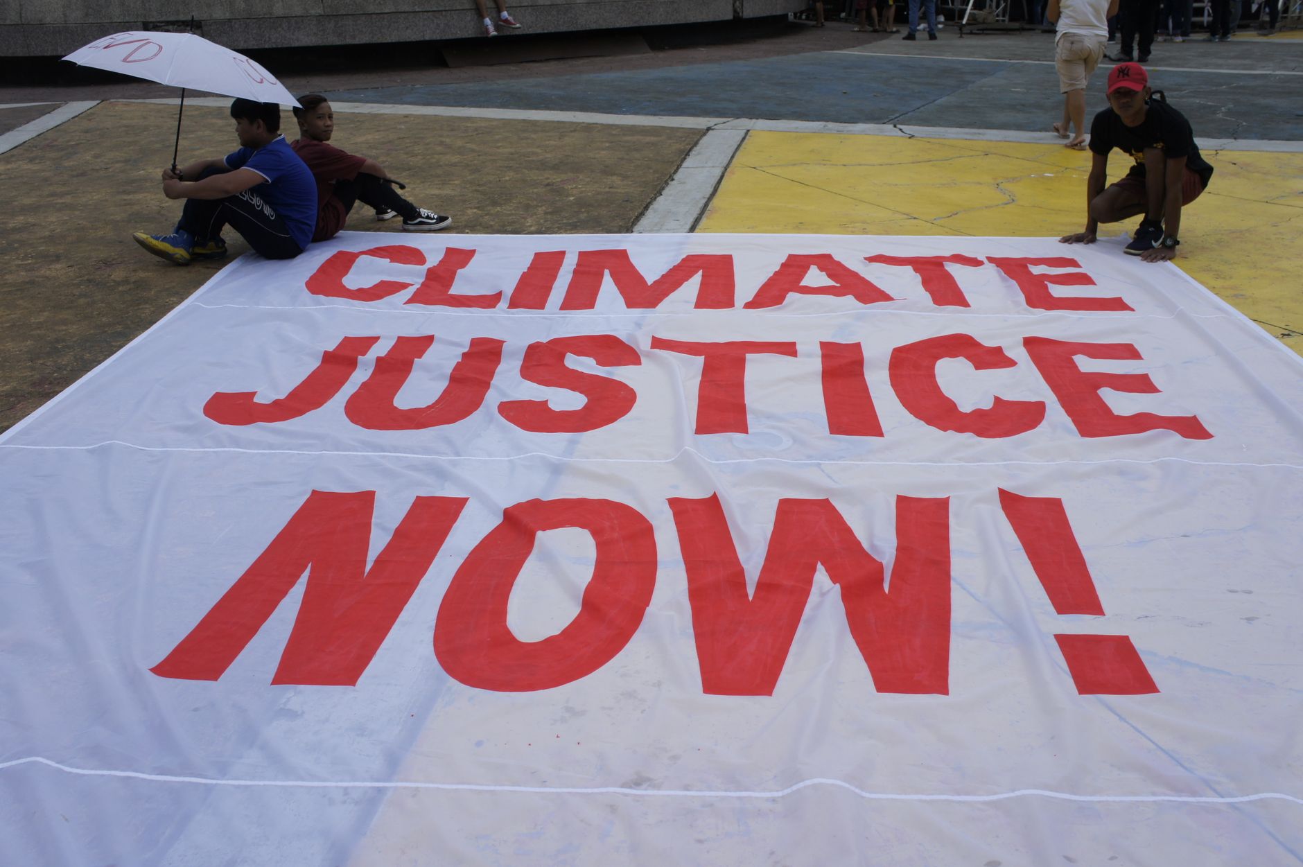 Climate Justice Now protest banner