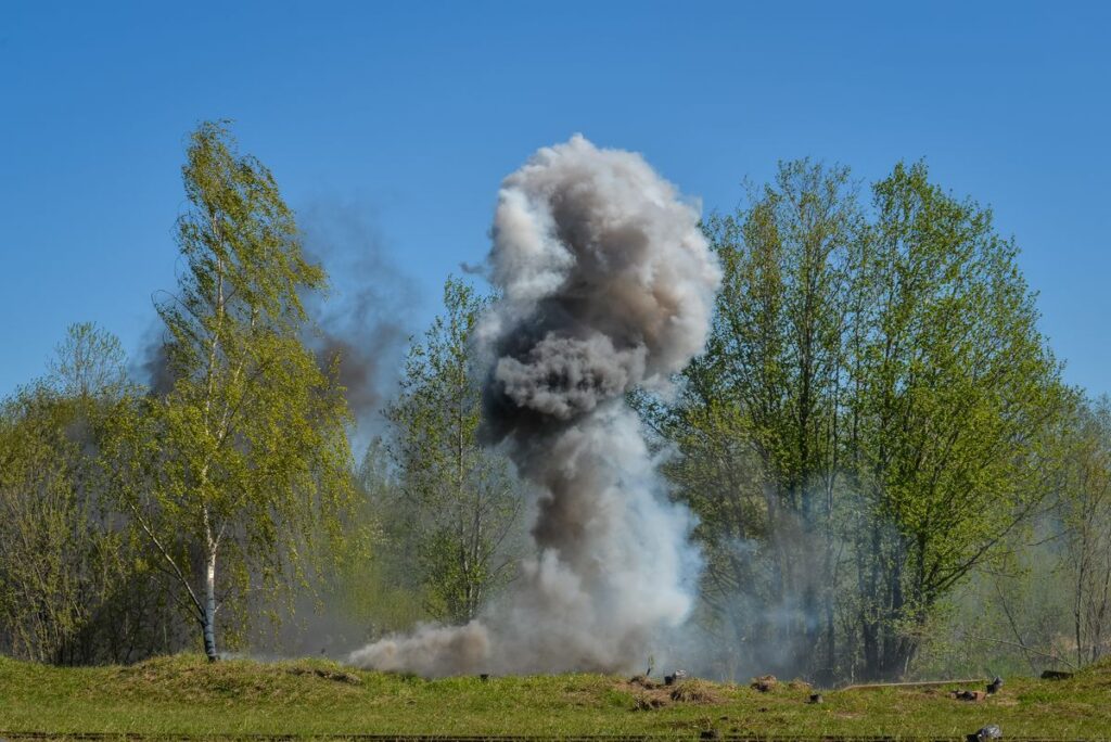 A powerful explosion creating a large cloud of smoke