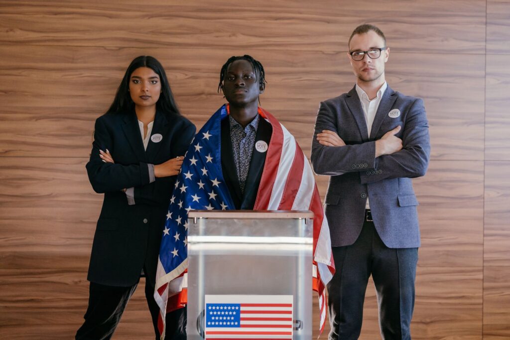 Political candidates standing with the American flag